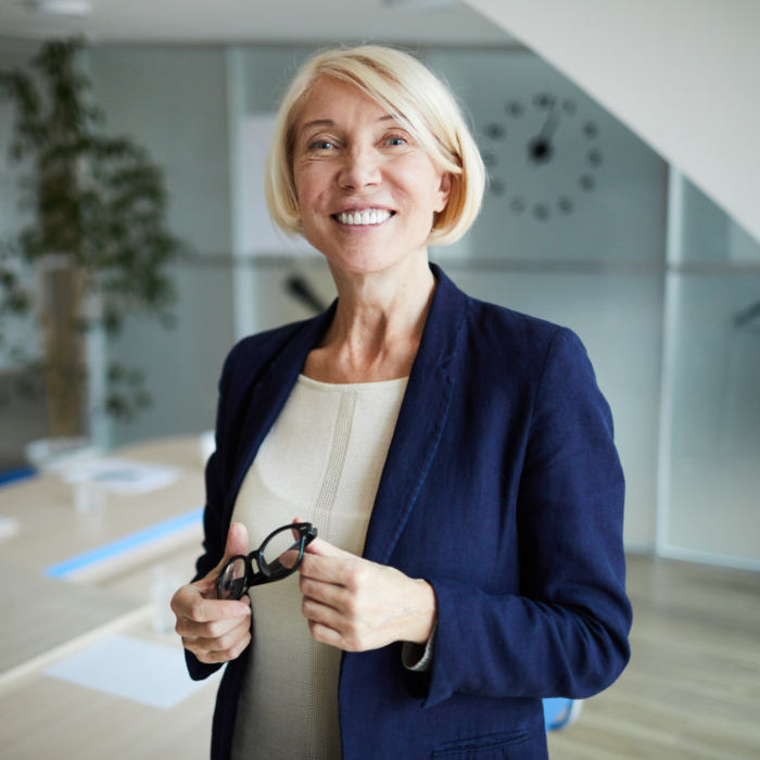 Experienced business leader in a contemporary office setting, representing the senior talent driving Belfast’s evolving 2026 employment market. This image reflects executive leadership, strategic workforce planning and the importance of attracting experienced professionals in Northern Ireland.