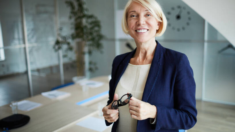 Experienced business leader in a contemporary office setting, representing the senior talent driving Belfast’s evolving 2026 employment market. This image reflects executive leadership, strategic workforce planning and the importance of attracting experienced professionals in Northern Ireland.