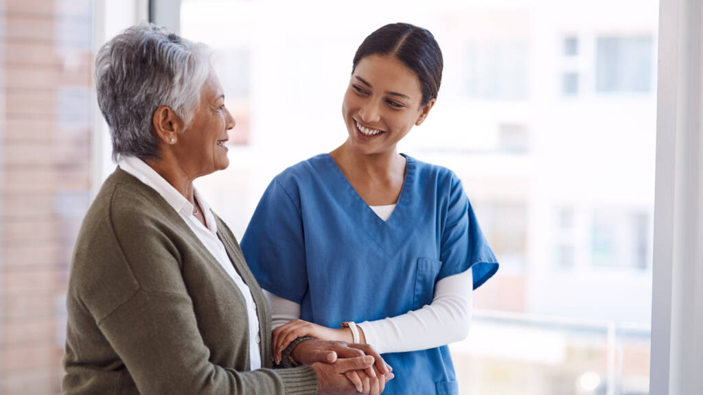 Medical employee holding a patient's arm