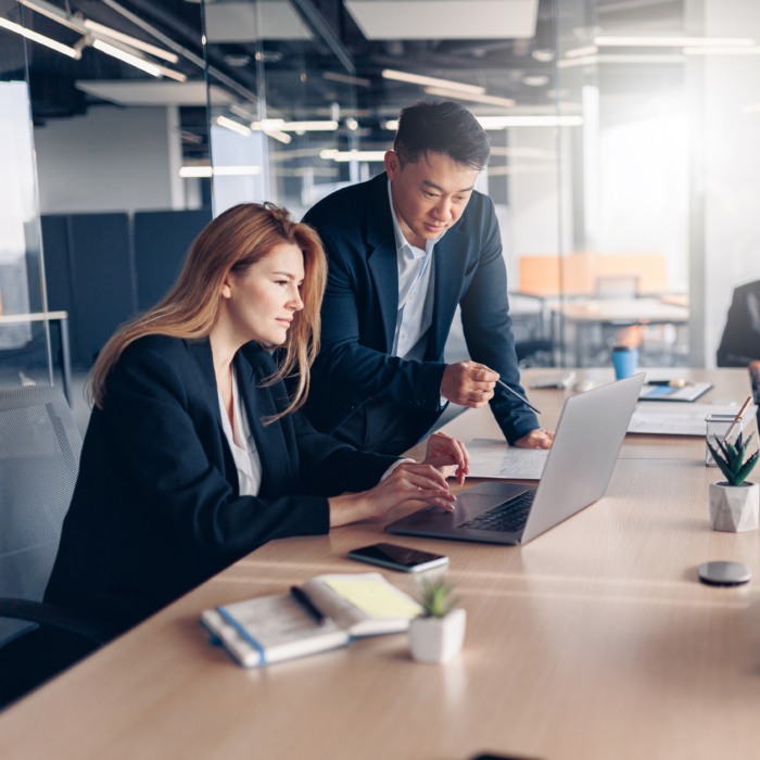 Senior leader providing strategic guidance during a planning session, representing the importance of executive involvement in workforce decisions. Organisations navigating Belfast’s 2026 talent market must integrate leadership insight into recruitment planning.
