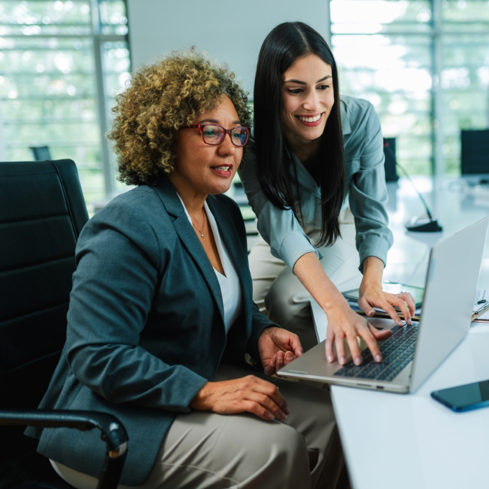 Business leaders analysing recruitment and workforce data in a contemporary meeting environment. In Belfast’s competitive labour market, informed decision-making and structured hiring processes are critical to securing and retaining high-quality talent.