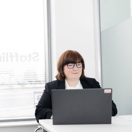 Woman working on computer in Staffline office