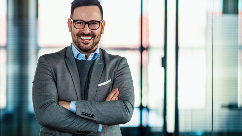 Confident senior professional in a modern office environment, representing experienced leadership within Belfast’s evolving 2026 talent market. As competition for senior-level talent intensifies, employers must refine employer branding, remuneration strategies and succession planning to secure high-performing leaders.